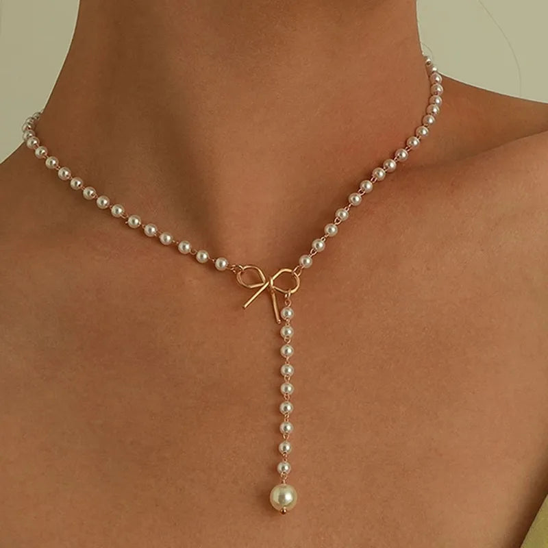 Collier Choker Perles d'Imitation & Pompons – Tendance & Féminin